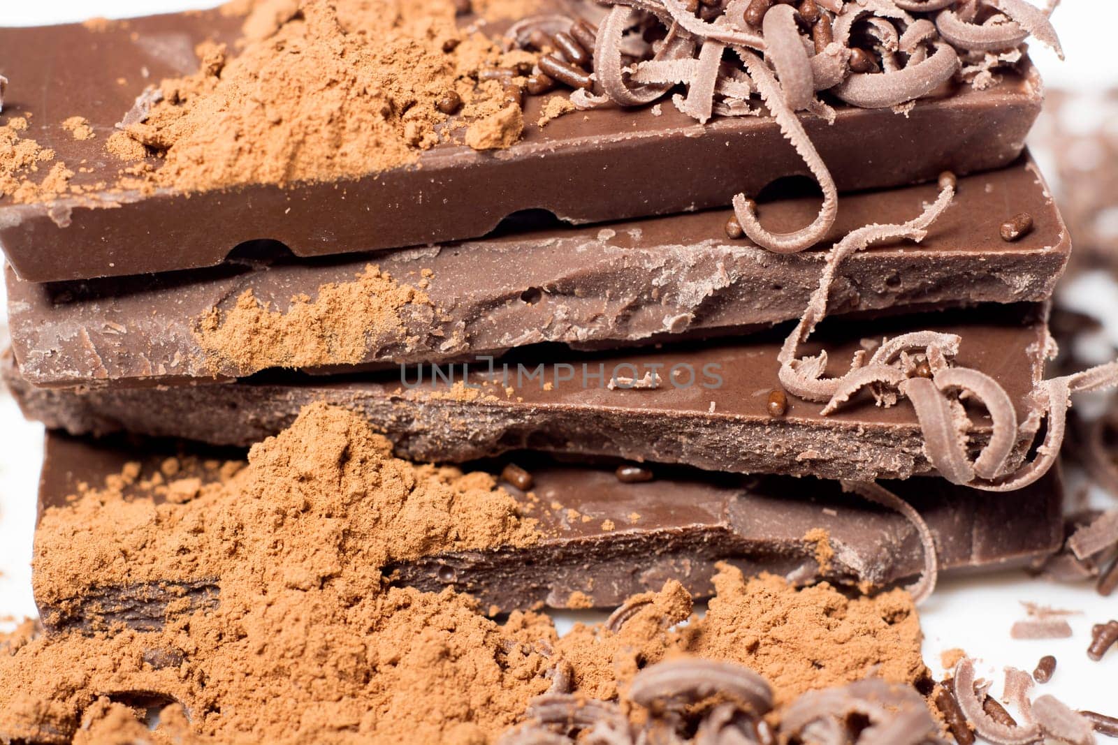 Parts of dark chocolate on the table