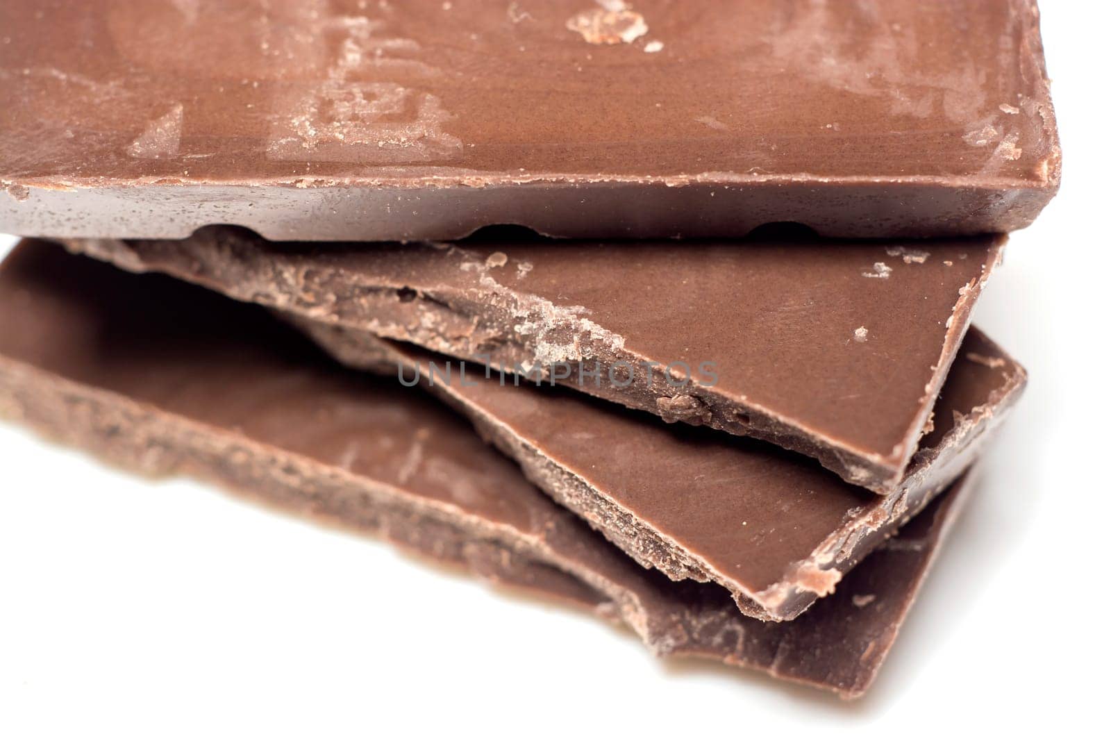 Parts of dark chocolate on the table