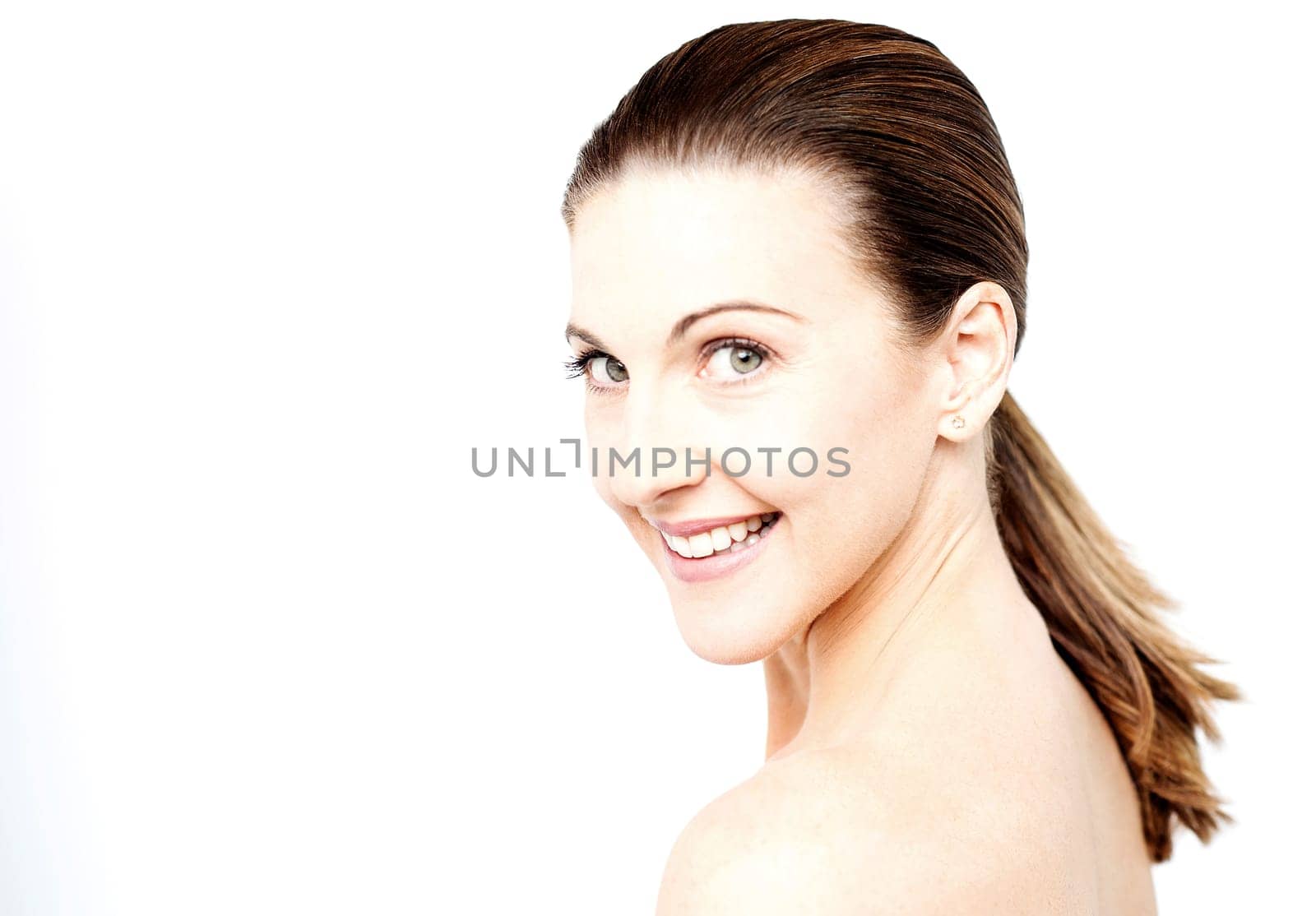 Happy woman posing topless to camera against white