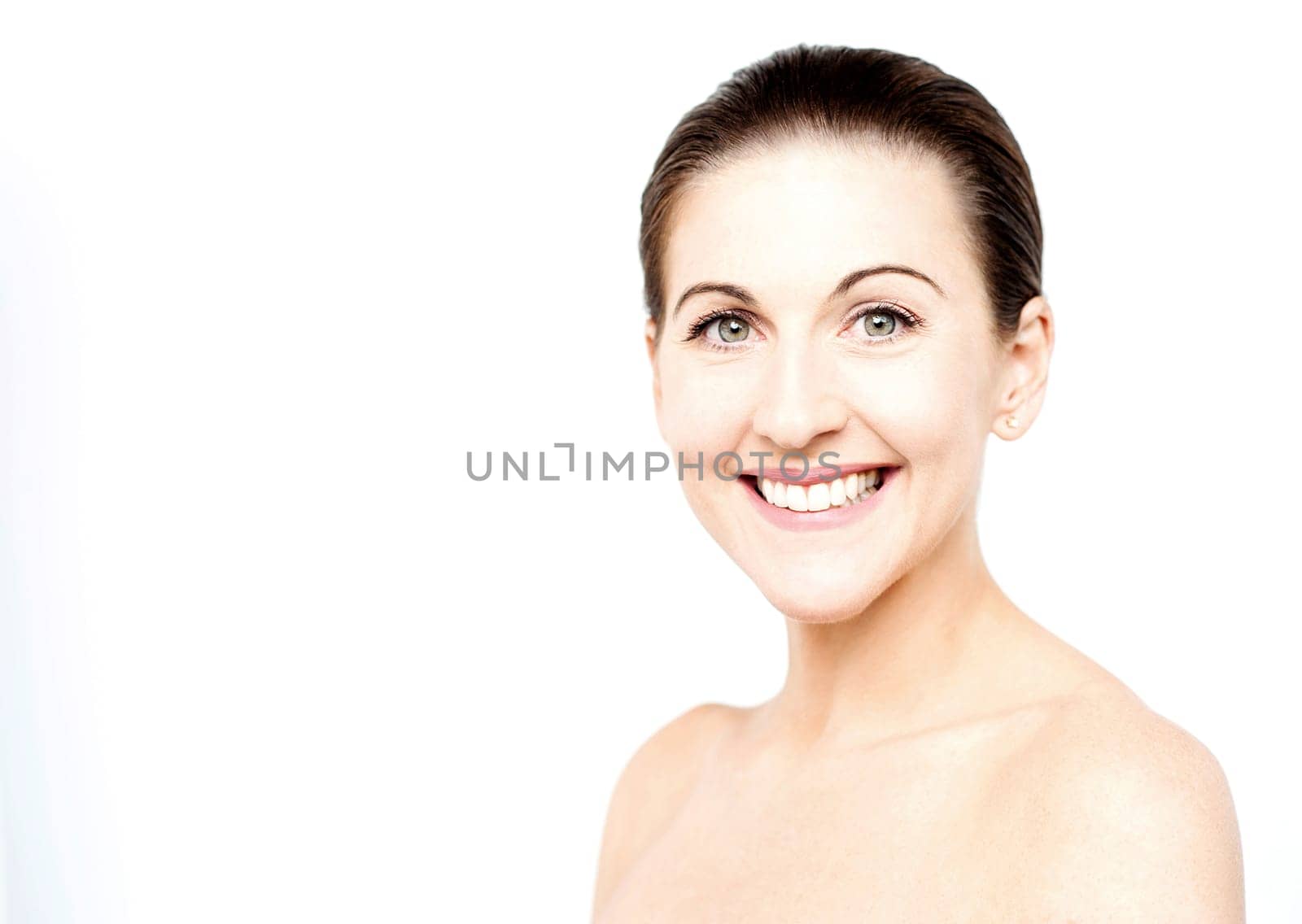 Smiling beautiful blonde woman with bare shoulders