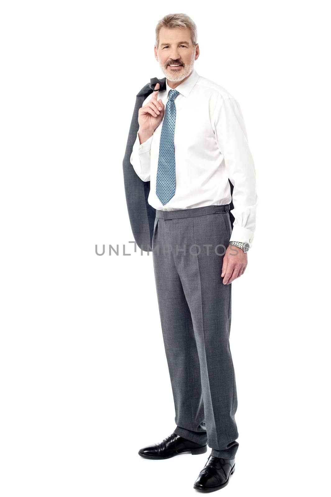 Image of a senior businessman holding coat over his shoulder