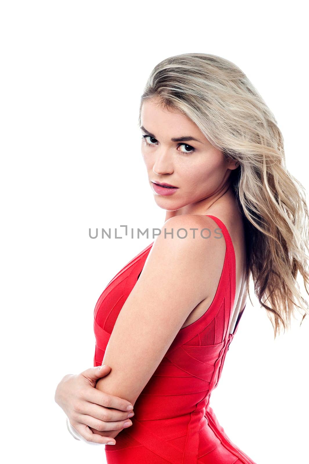 Beautiful young woman posing in red dress