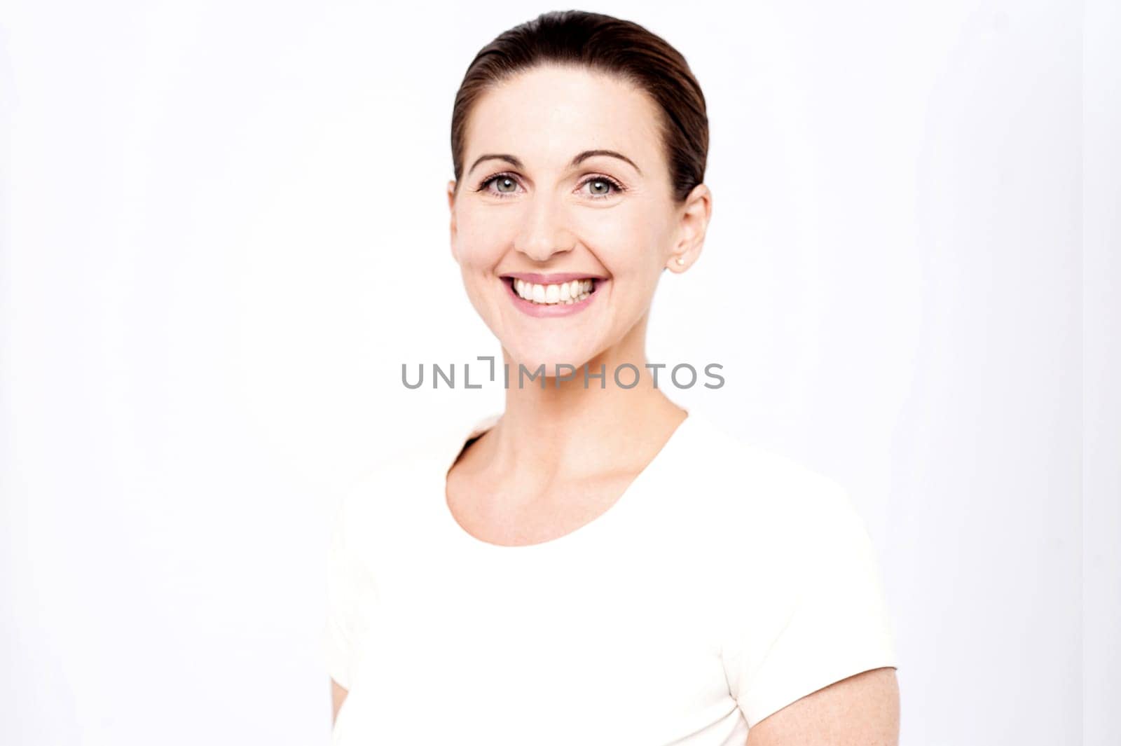 Half length image of a smiling beautiful woman posing in style