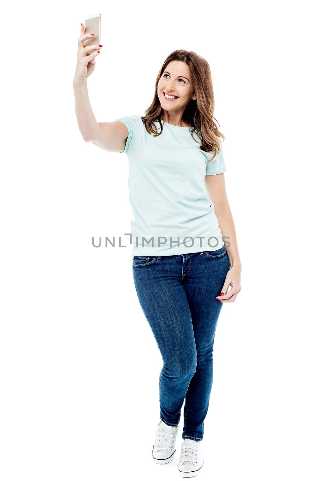 Beautiful lady taking selfie with her mobile