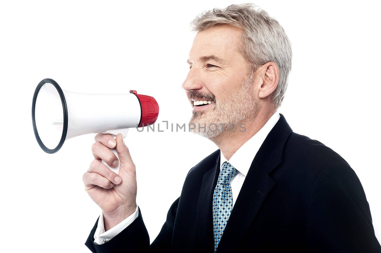 Side pose of senior businessman holding loudhailer