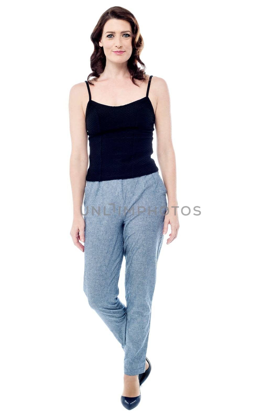 Pretty young woman with sleeveless top over white