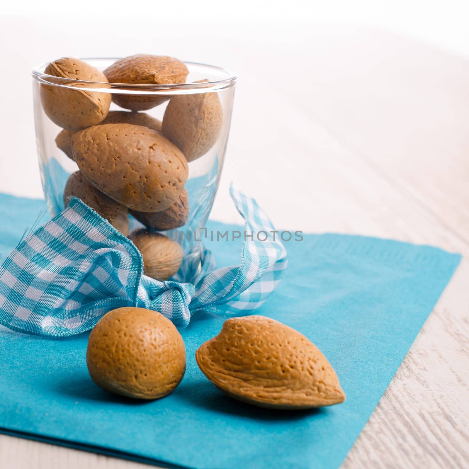 Almonds in a glass on a wooden table