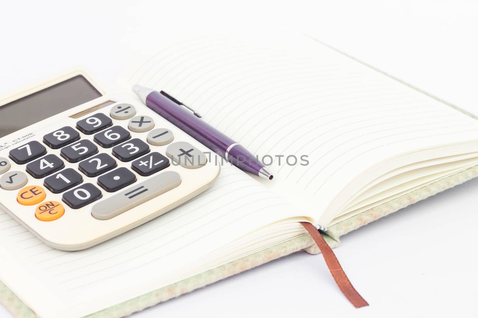Notebook with pen isolated on white background, stock photo