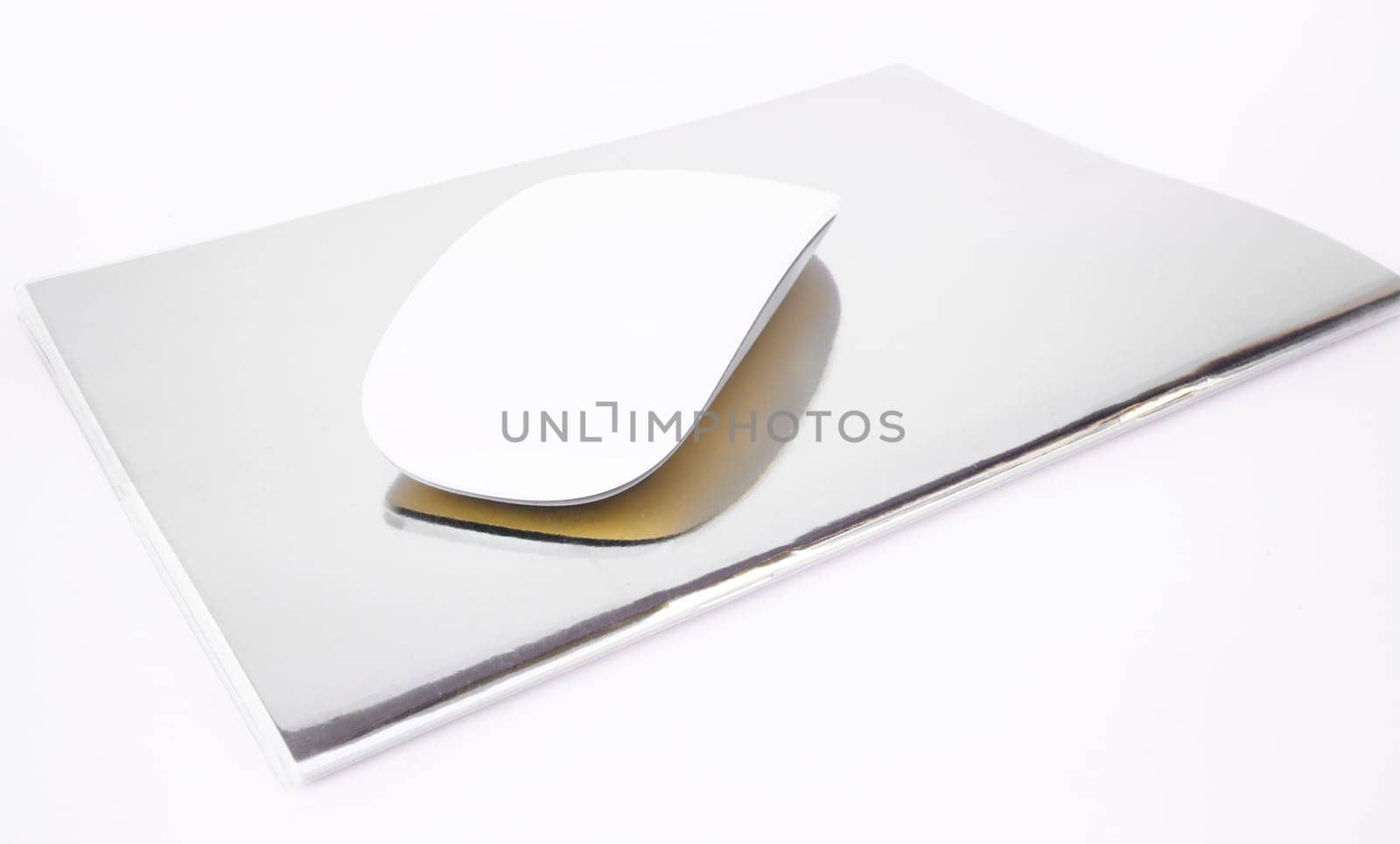 Wireless mouse top note book isolated on white background, stock photo