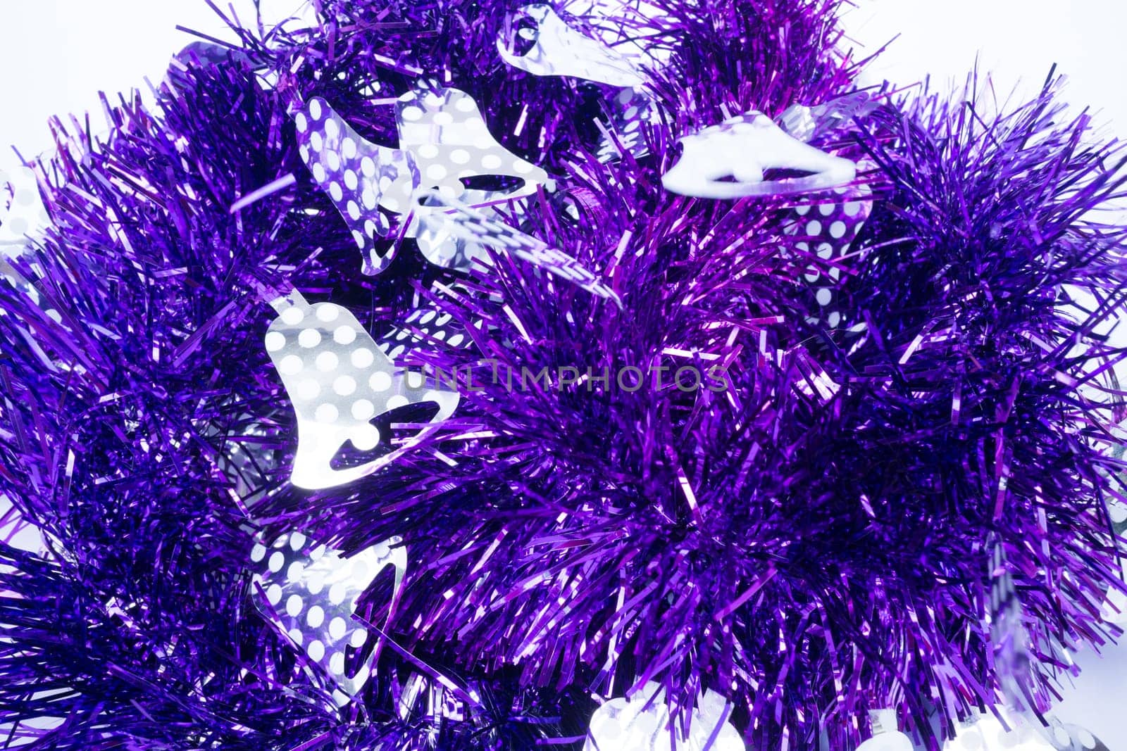 Purple holiday decoration ribbon on white background, stock photo