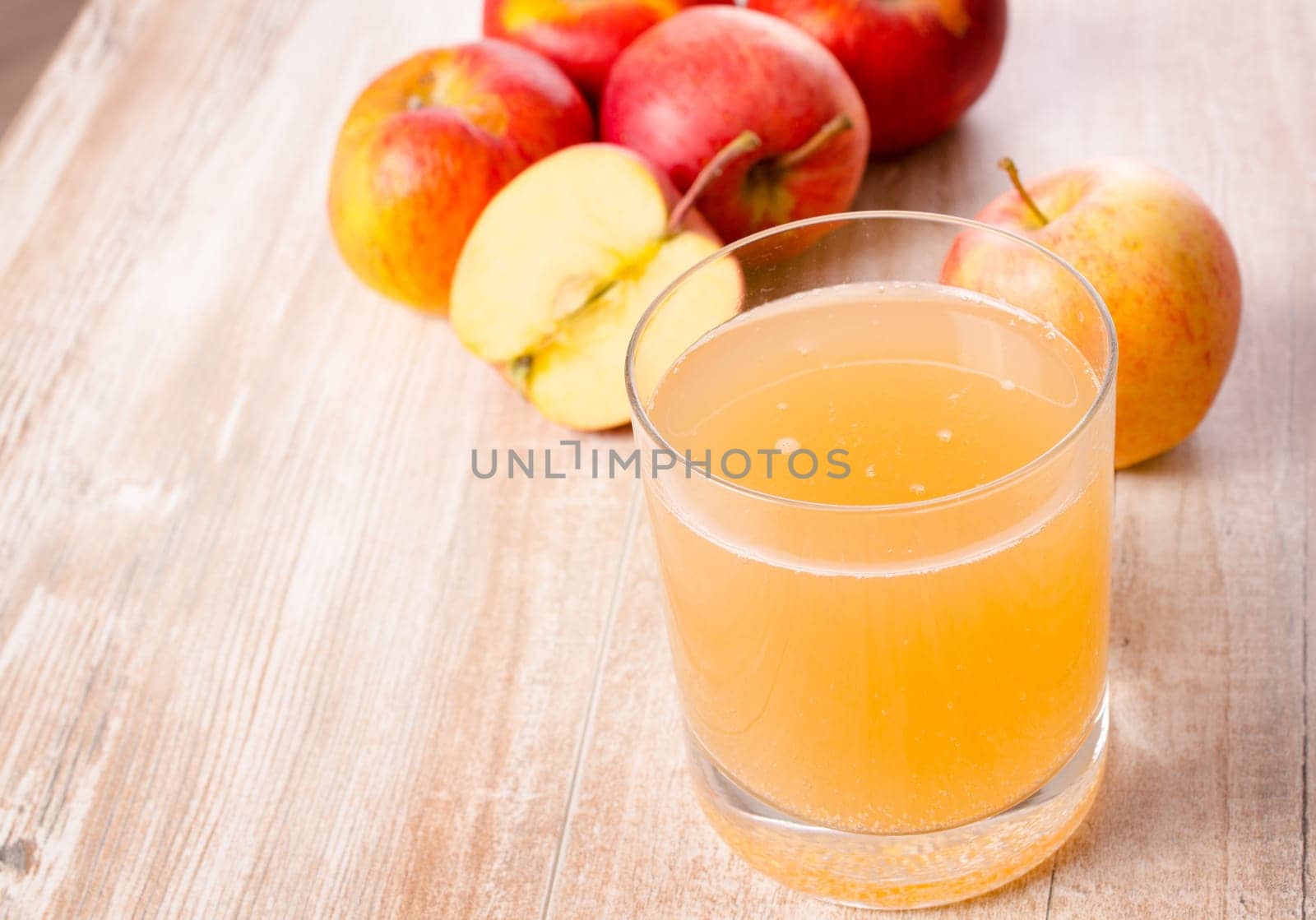 Glass of organic apple juice on a kitchen table
