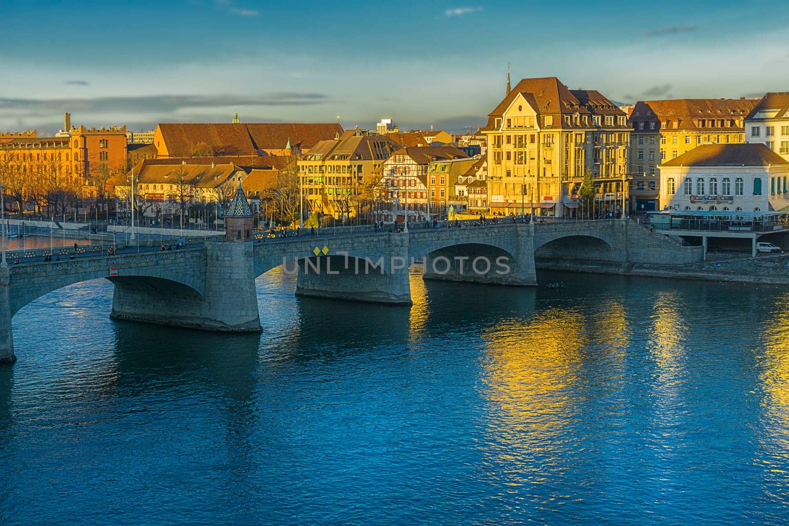 Golden light on the banks of the Rhine in Kleinbasler