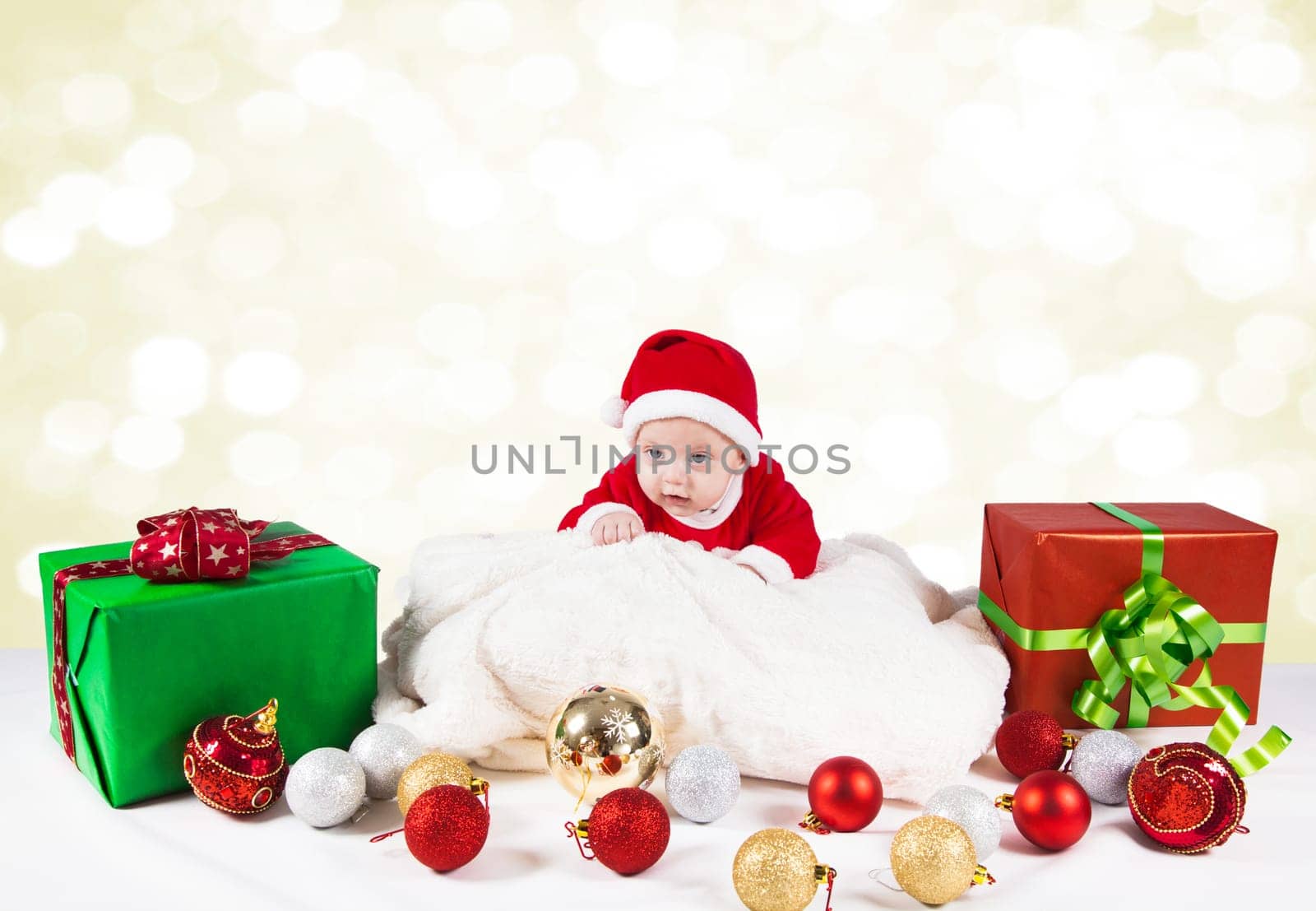 5 months old baby dressed as Santa for Christmas.