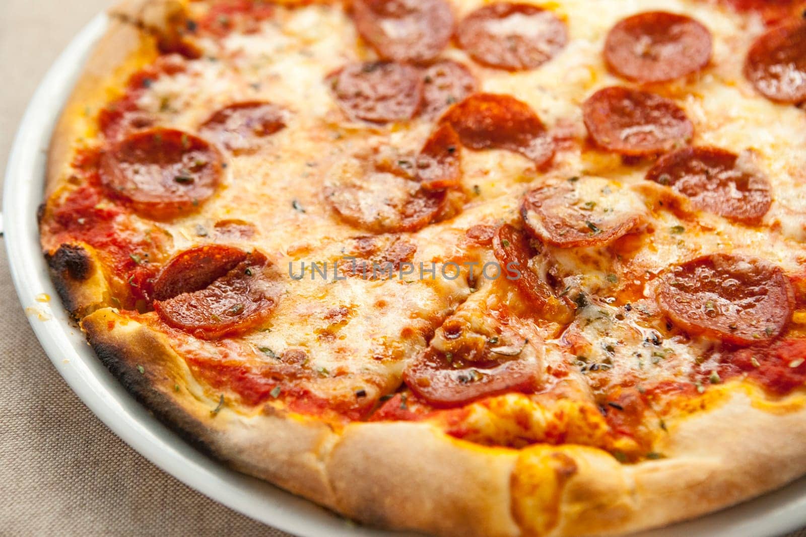 Delicious fresh pepperoni pizza on plate. Selective focus
