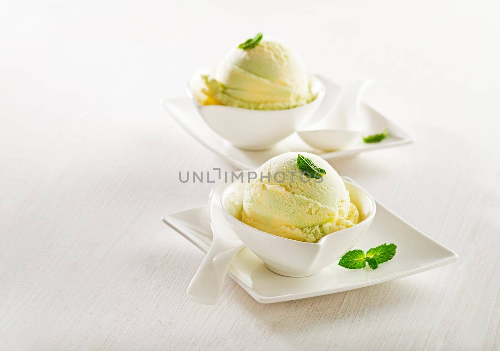 Fresh fruit sorbet ice cream in a white bowl.