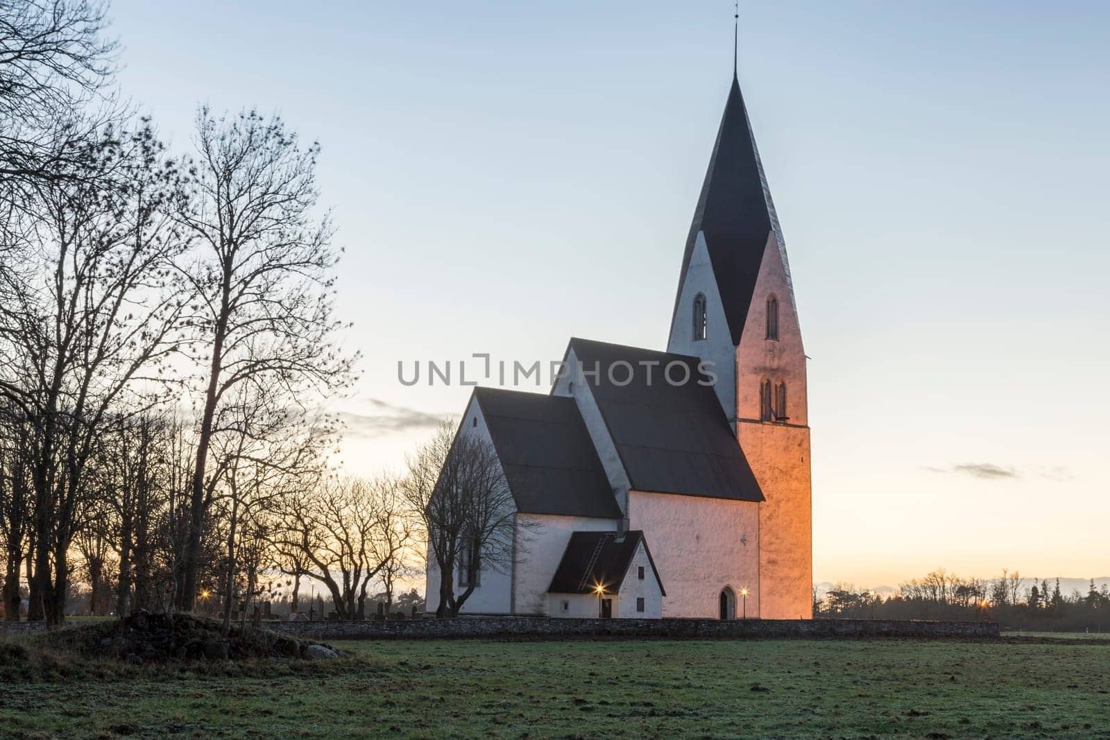 Church in Tofta, Gotland in Sweden with the pathway leading up the the church.