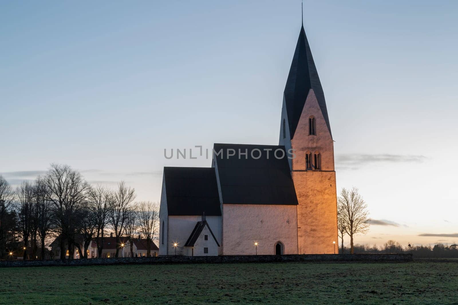 Church in Tofta, Gotland in Sweden with the pathway leading up the the church.