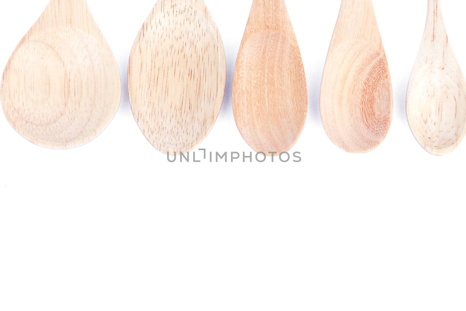 Wooden kitchen utensils isolated on white background, stock photo