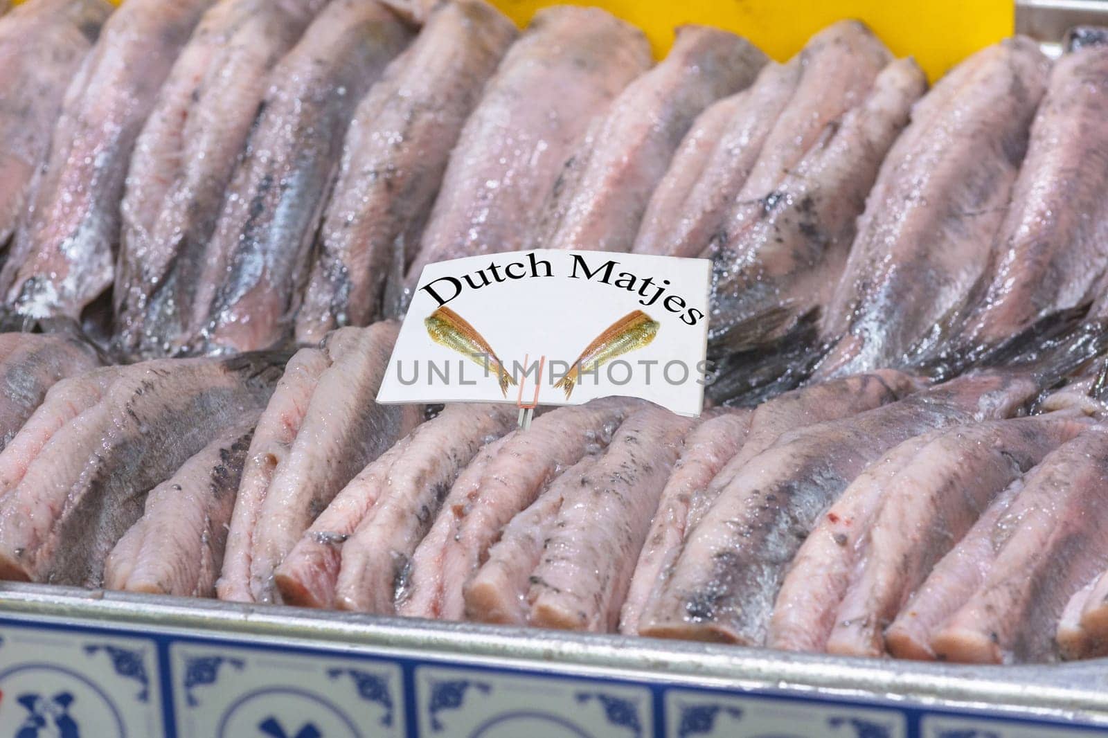 Fresh Matjes fish chilled on ice at the fish market.