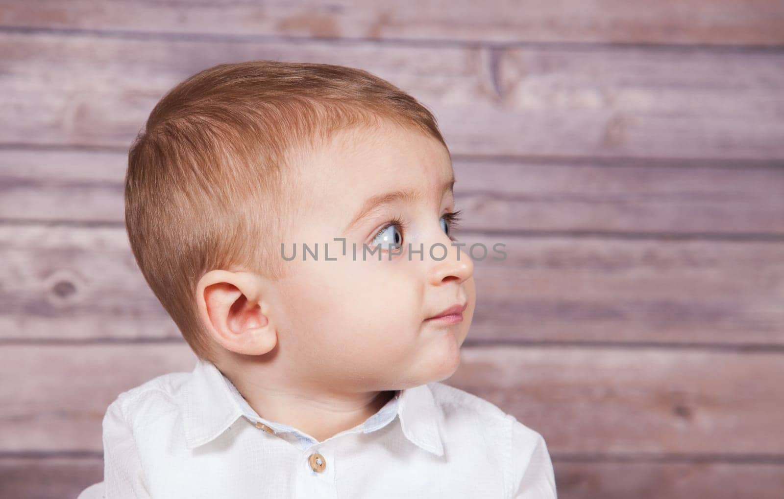 Portrait of 1 year old baby boy, Christmas theme, studio shot.