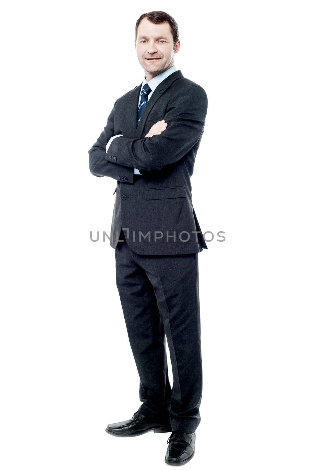Confident business man posing with crossed arms