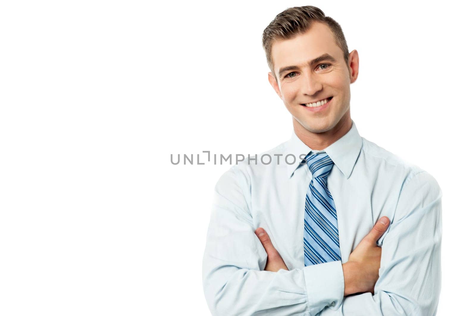 Smiling business entrepreneur posing with crossed arms
