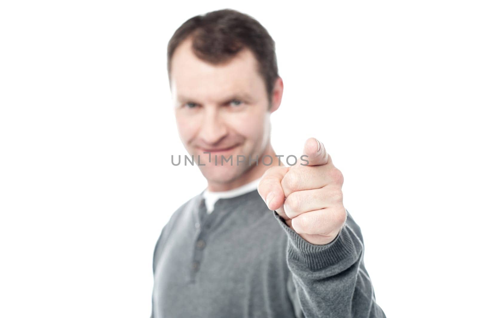Casual man pointing his index finger towards camera