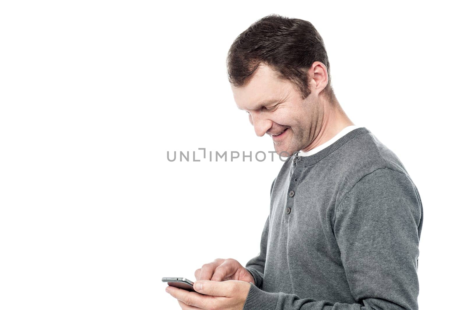 Casual middle aged man using mobile phone