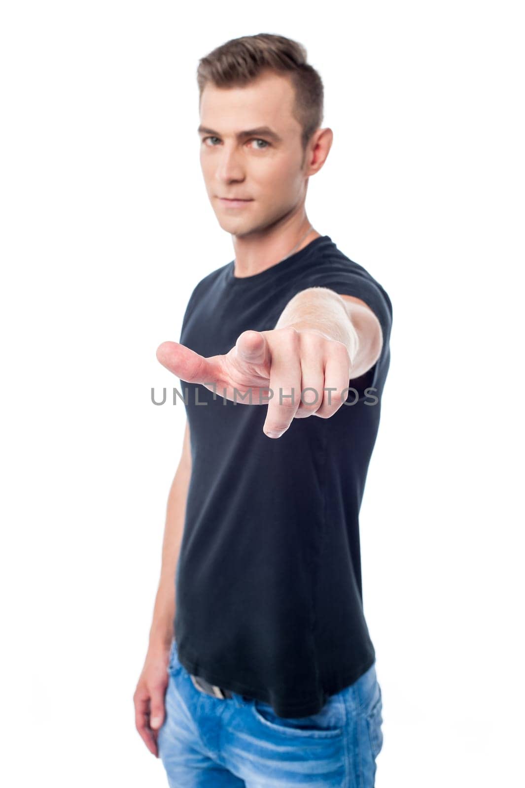Young guy pointing index finger towards camera