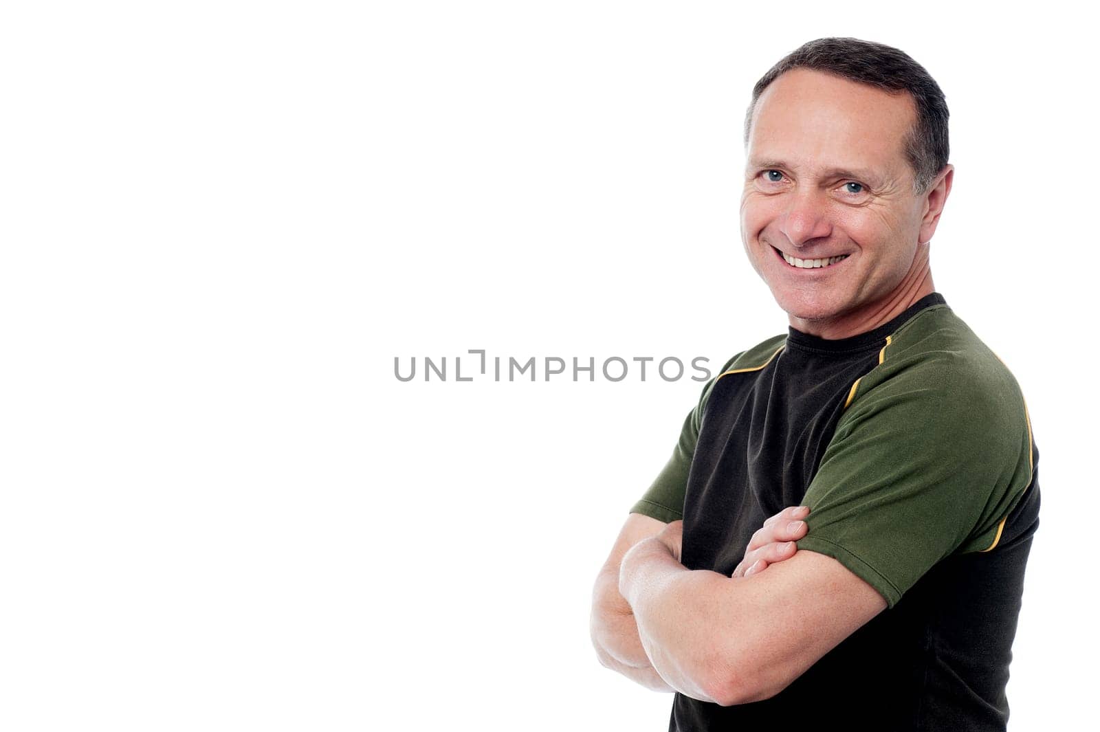 Happy senior posing casually with crossed arms