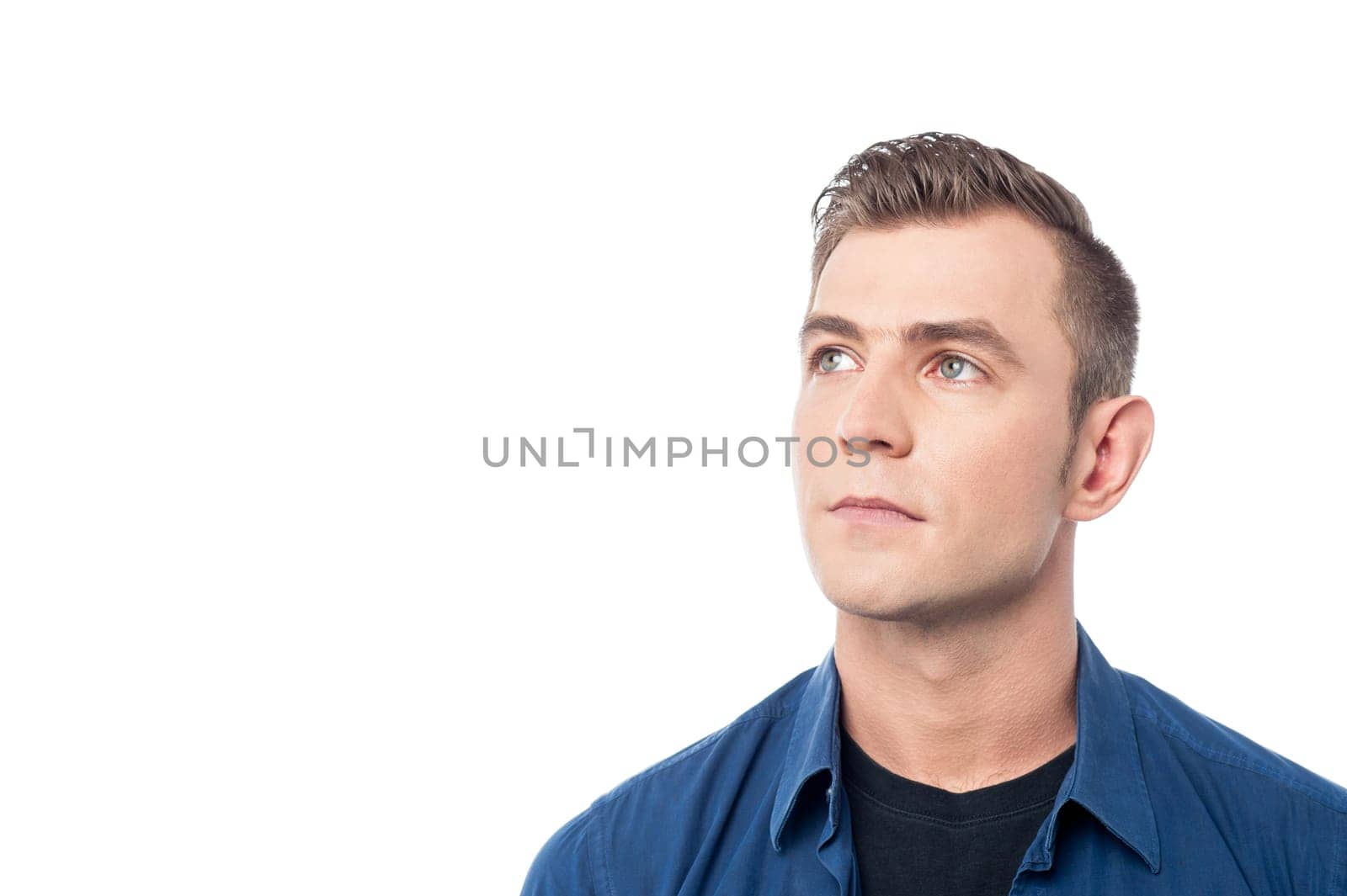 Young man looking away at something casually