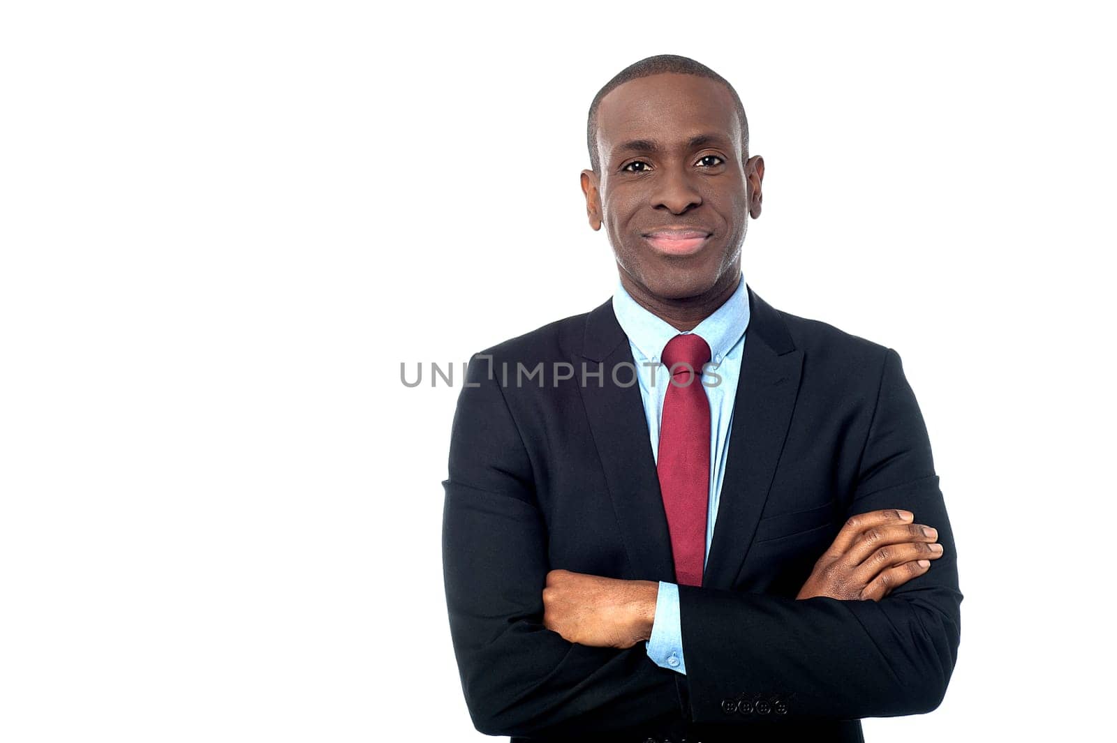 Happy business executive with arms folded