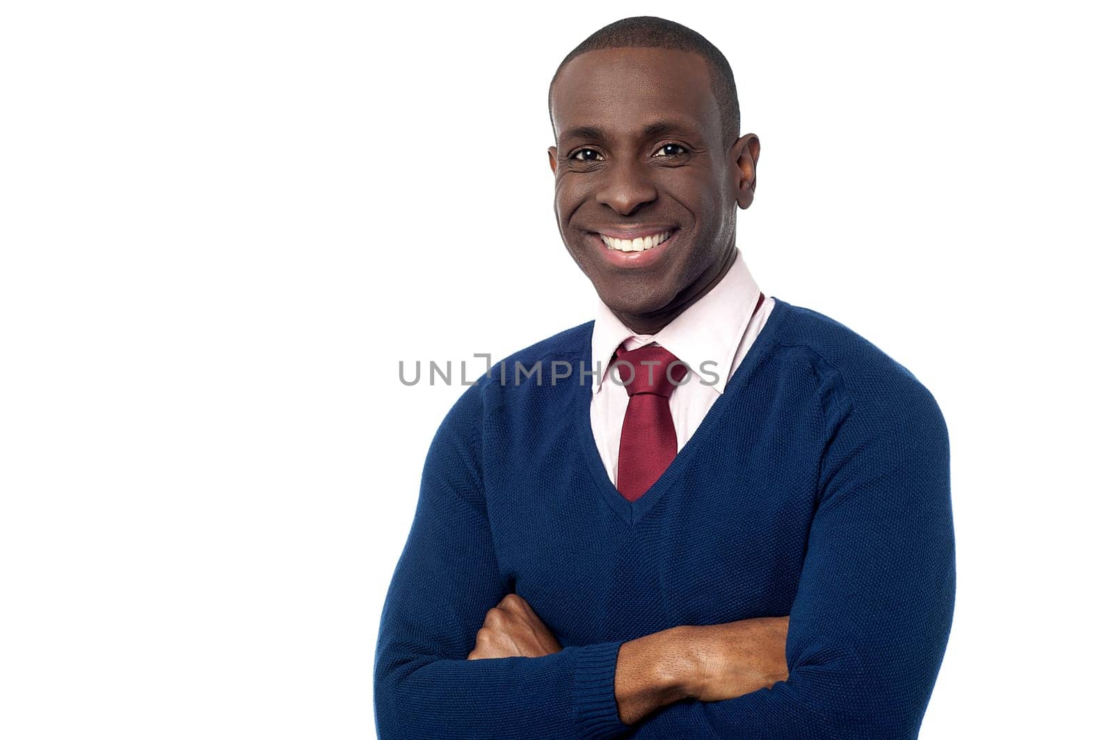 Young professional posing to camera with arms crossed