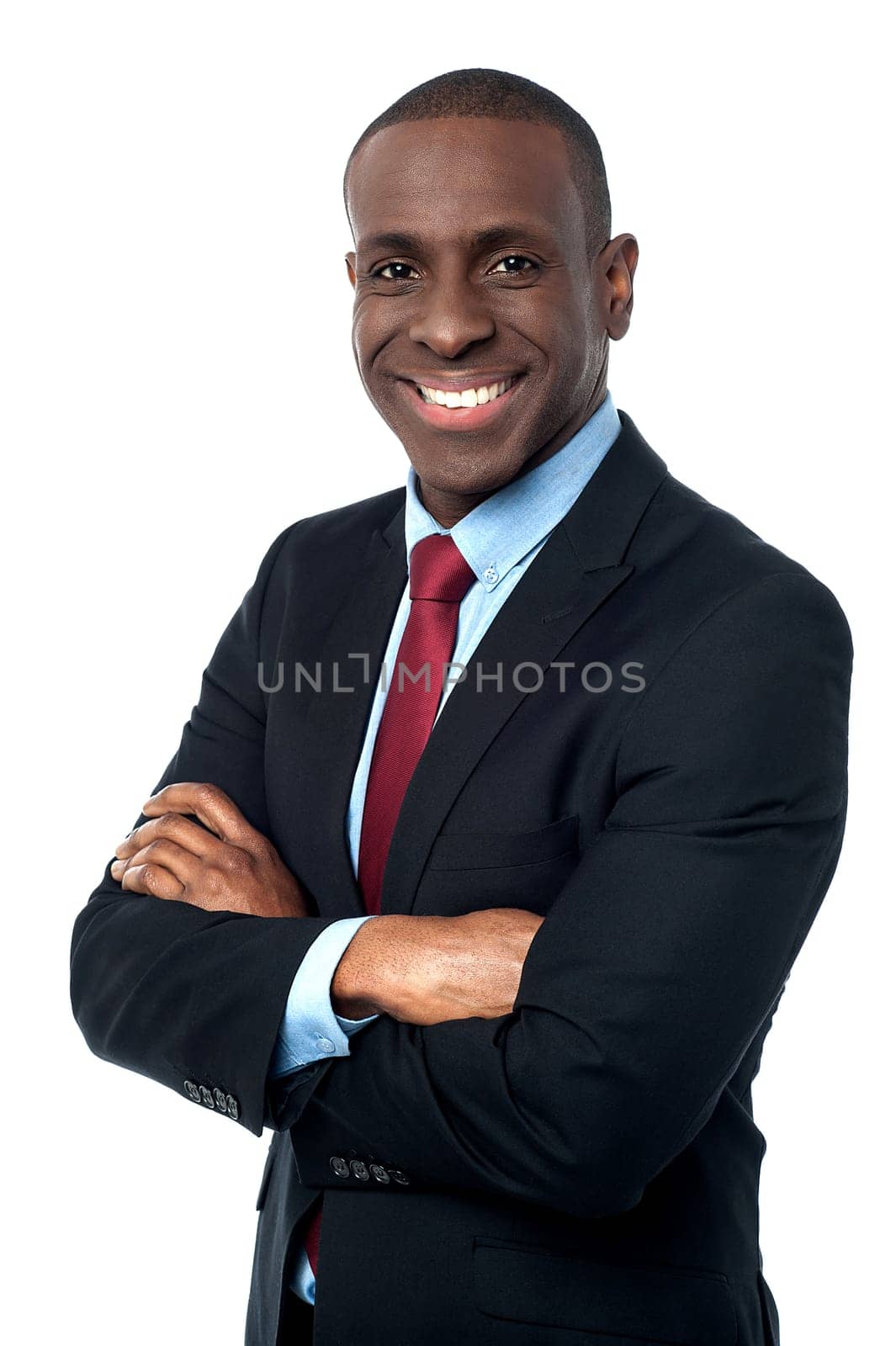 Confident business man with crossed arms over white