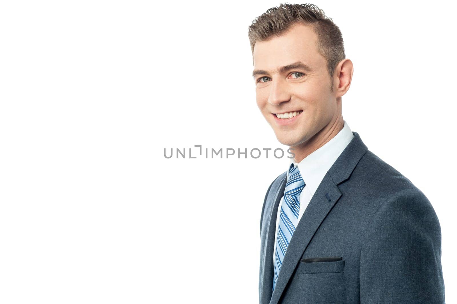 Side pose of young businessman over white