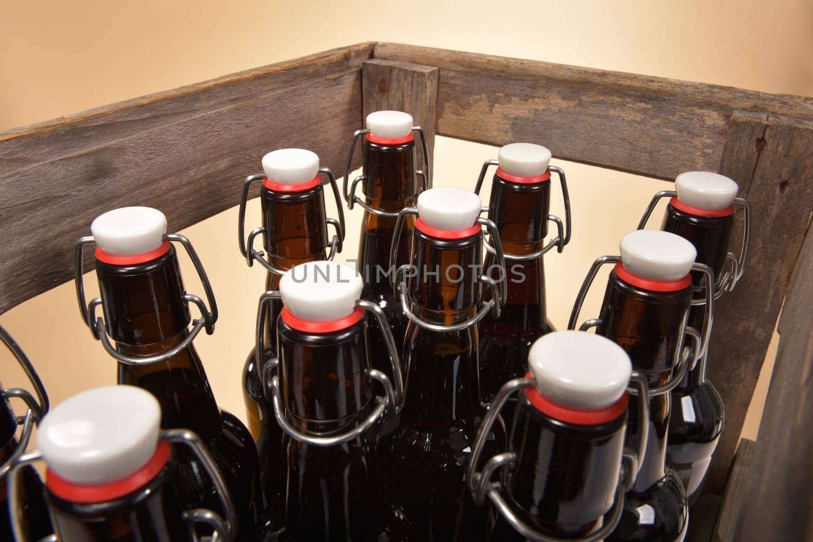Close-up of many beer bottles with ironing closure in old beer box