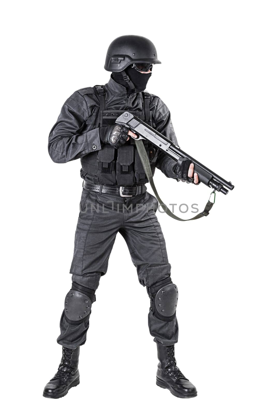 Spec ops police officer SWAT in black uniform with shotgun studio shot