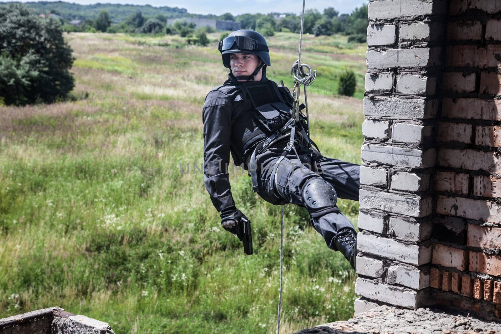 Spec ops police officer SWAT during assault operation
