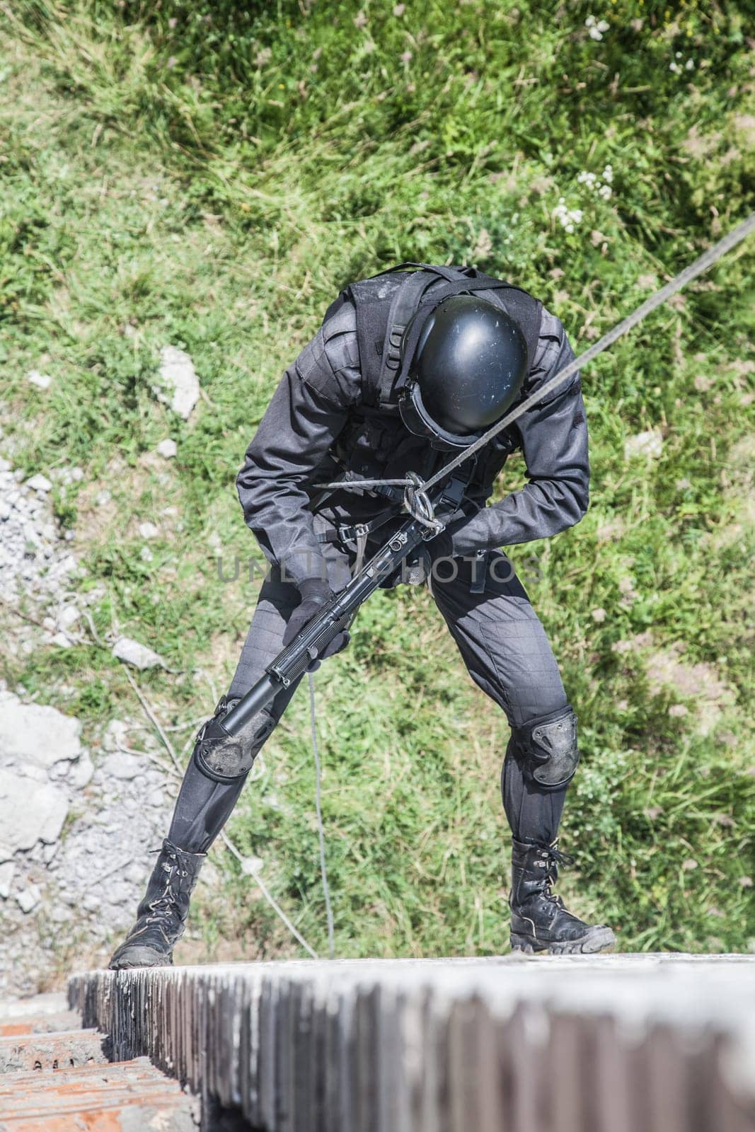 Spec ops police officer SWAT during assault operation
