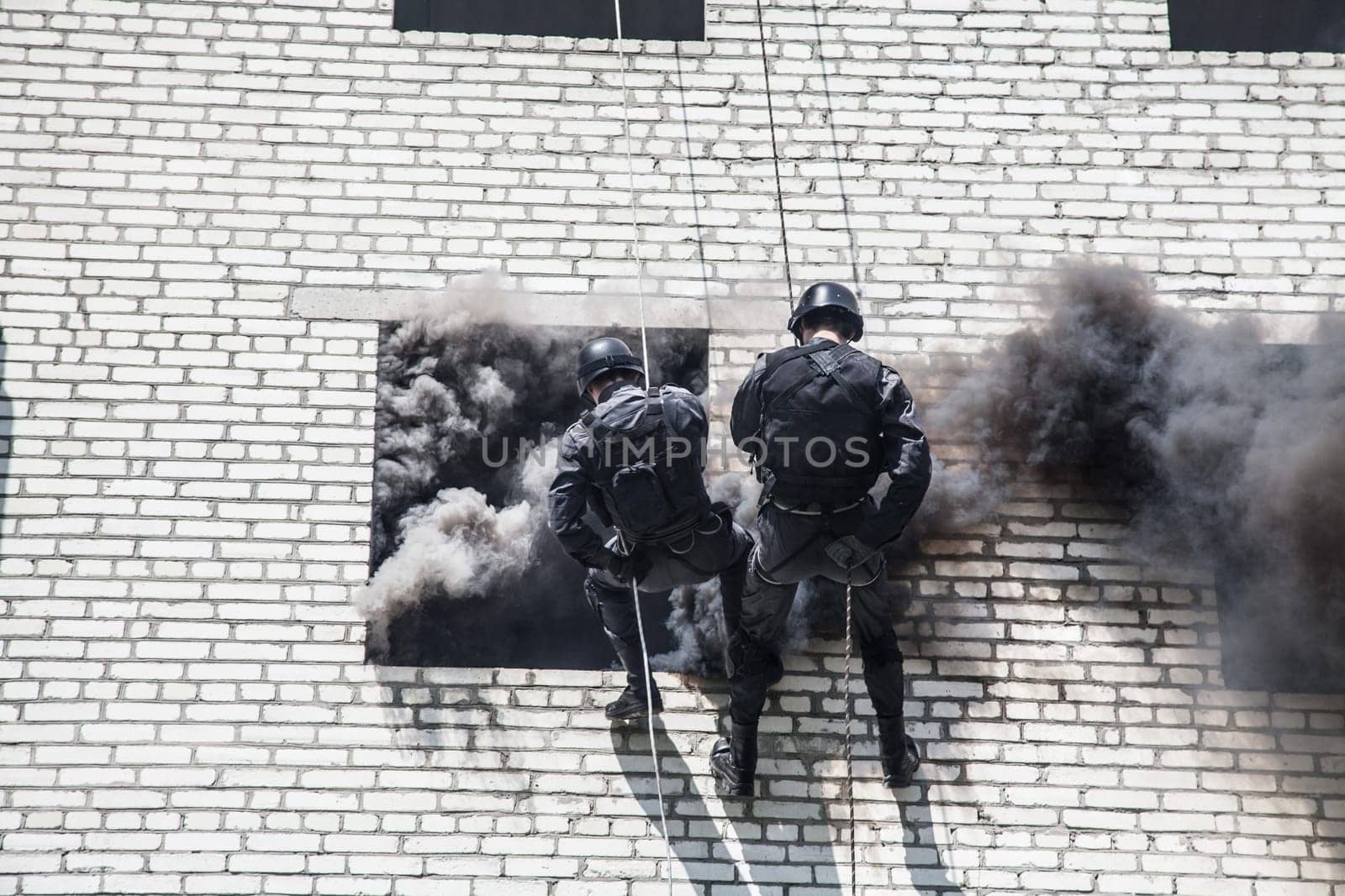 Spec ops police officer SWAT during assault operation