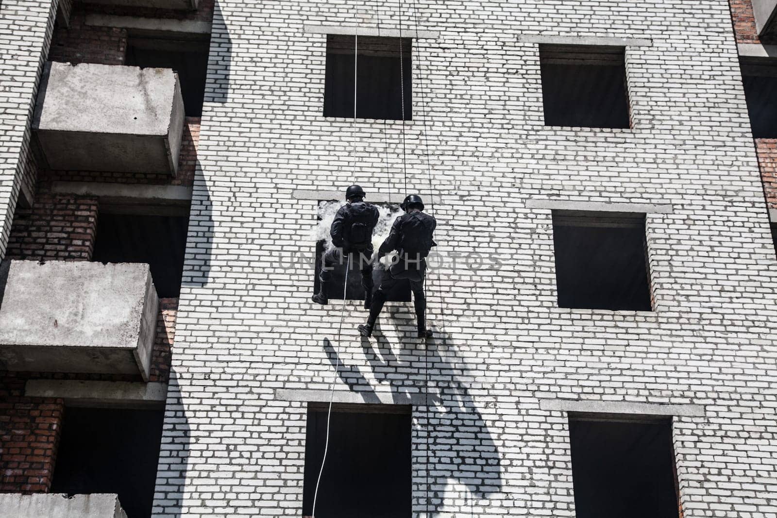 Spec ops police officer SWAT during assault operation