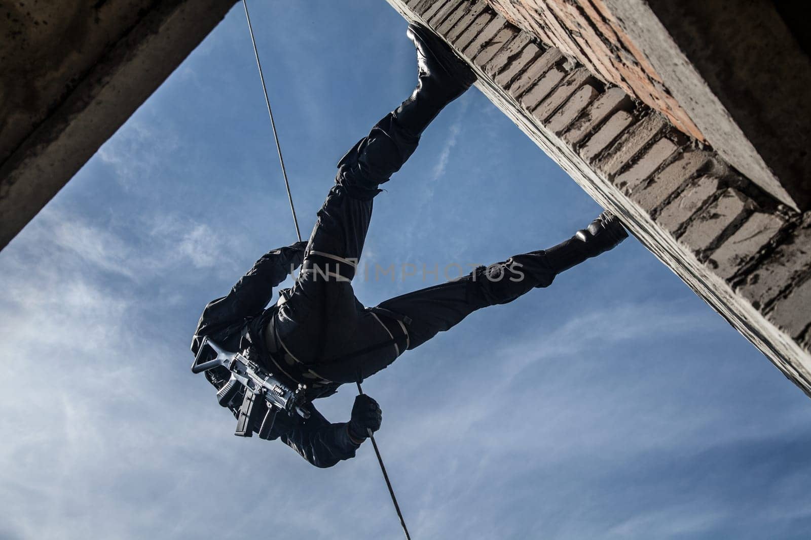 Spec ops police officer SWAT during assault operation