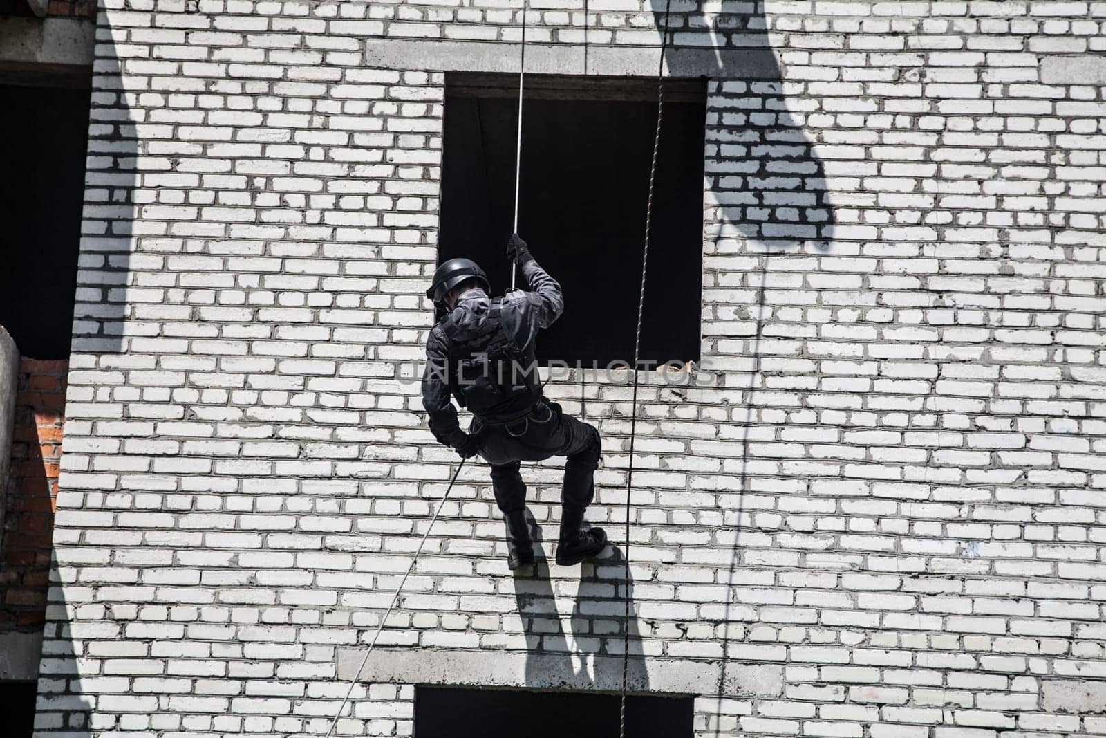 Spec ops police officer SWAT during assault operation