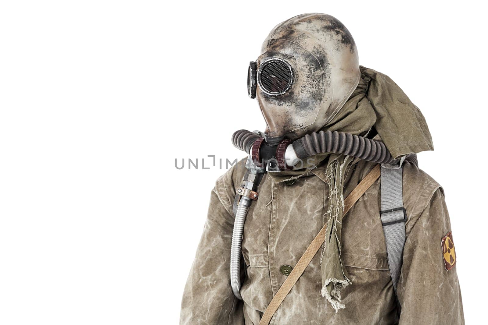 Nuclear post apocalypse. Studio shot of survivor in tatters and gas mask