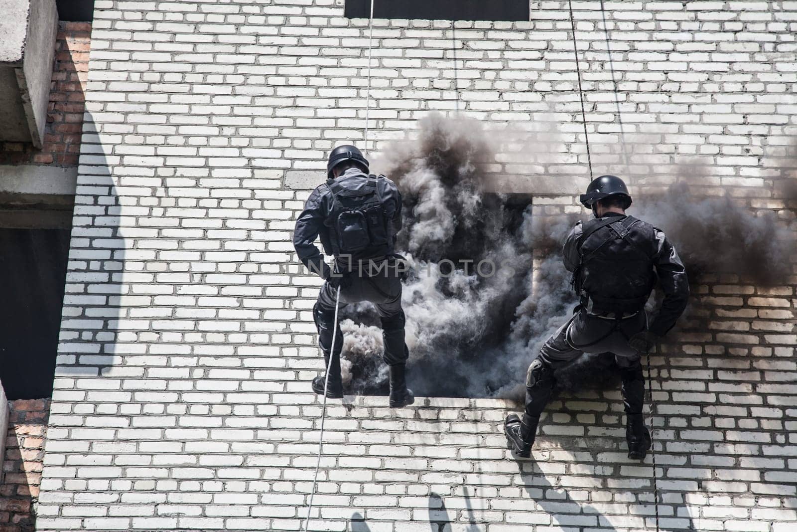 Spec ops police officer SWAT during assault operation