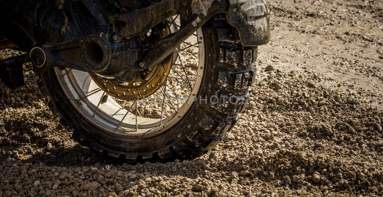 Close-up of a dirty motocross tyre - a motorsport for adrenaline junkies