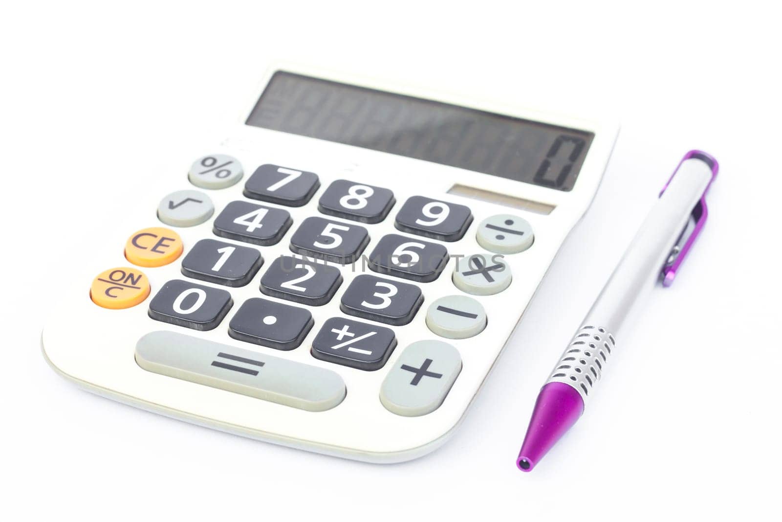 Calculator with pen isolated on white background, stock photo