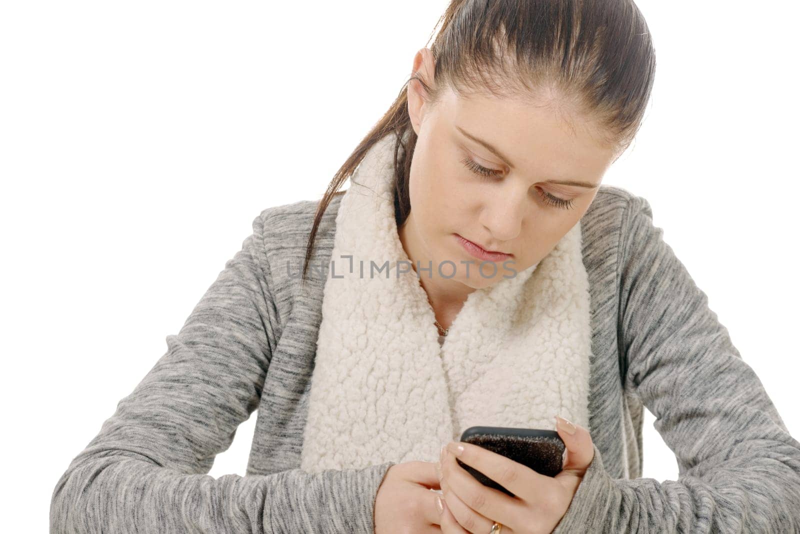a beautiful hispanic girl texting on her cellphone