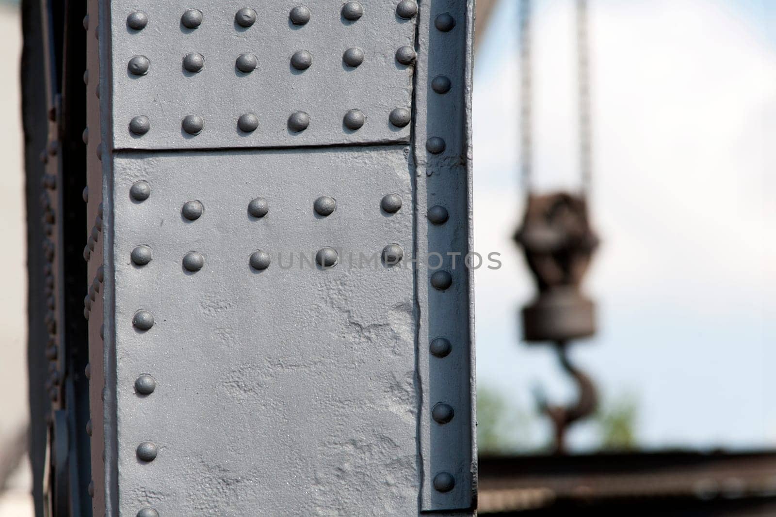 Solid crane steel with rivets and a crane hook