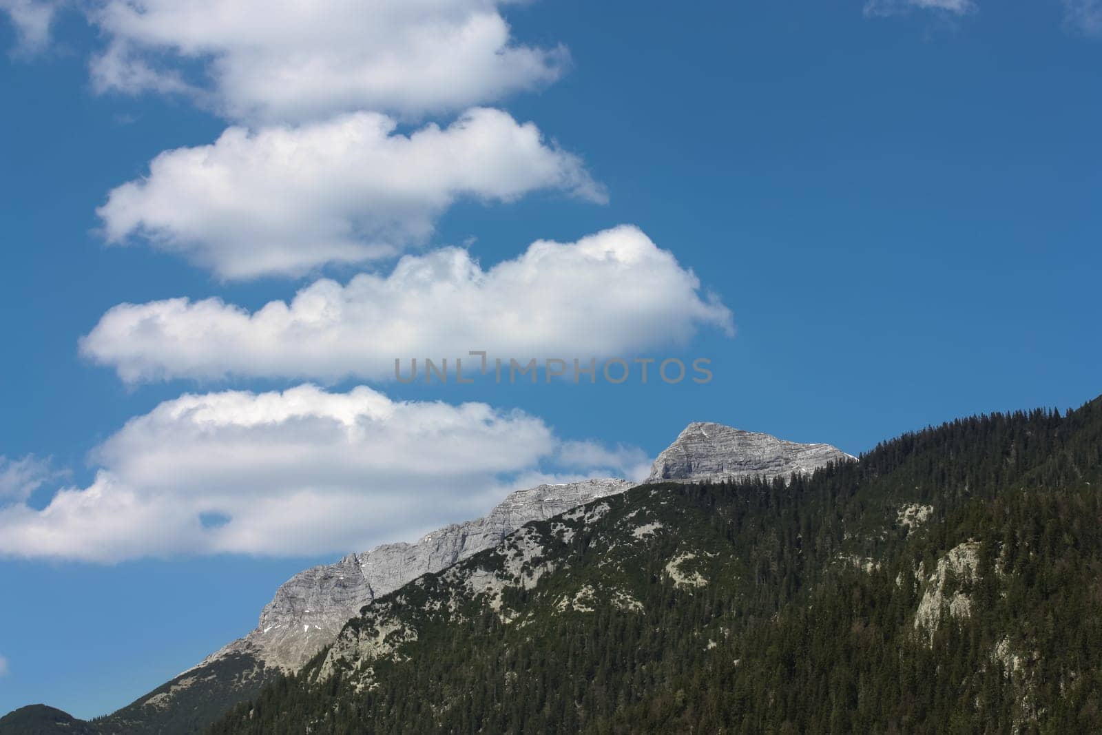 Around the Achensee in Austria - The Karwendel Mountains with smoke signs on the horizon